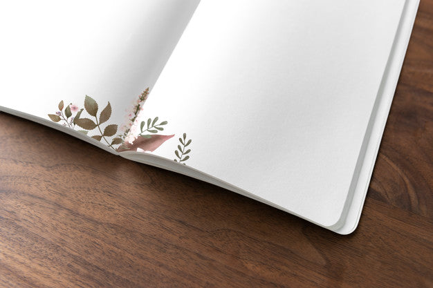 Floral Notebook Mockup On A Wooden Table Psd