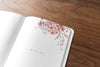 Floral Notebook Mockup On A Wooden Table Psd
