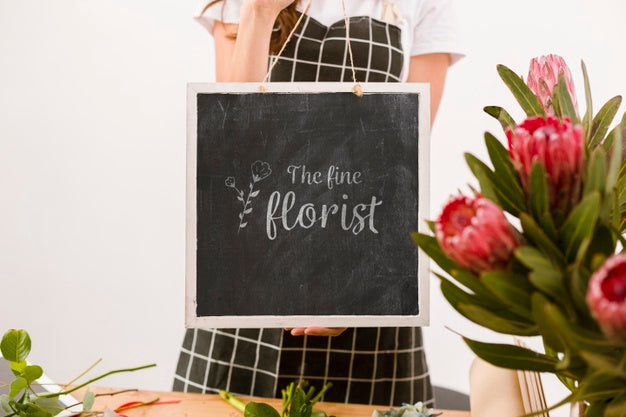 Florist Holding Mock-Up Sign Psd