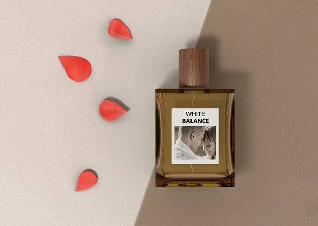 Flower Petals Next To Perfume Bottle Psd
