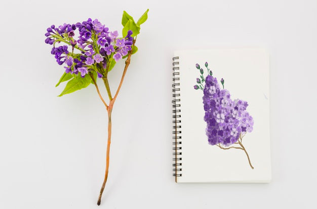 Flower With Realistic Paint On Notebook Psd
