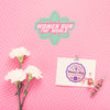 Flowers And Cardboard Mock-Up On Pink Background Psd