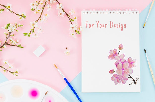 Flowers Beside Notebook With Realistic Draw Psd