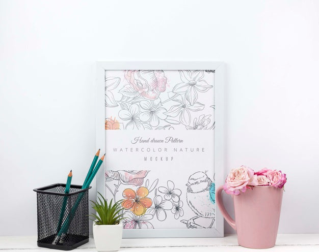 Flowers In A Cup Next To Frame Mockup Psd