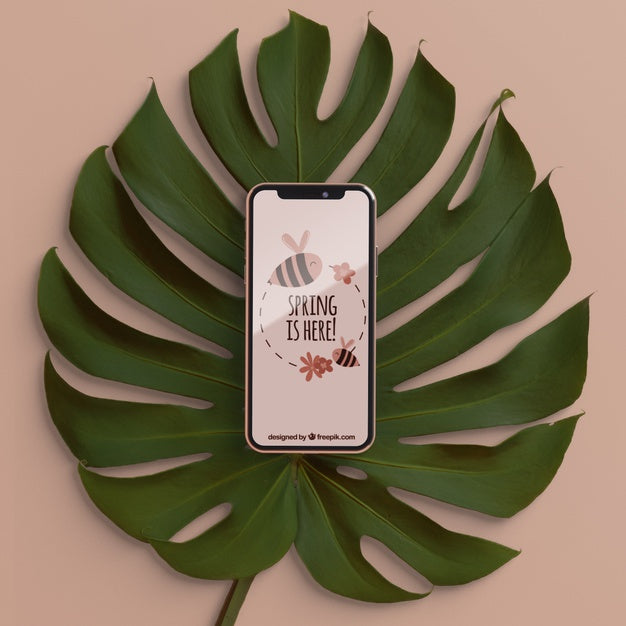 Foliage With Phone On Top Concept Psd