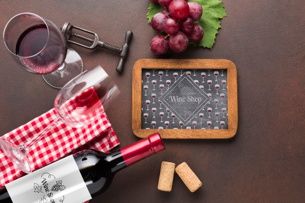 Frame And Natural Wine On Table Psd