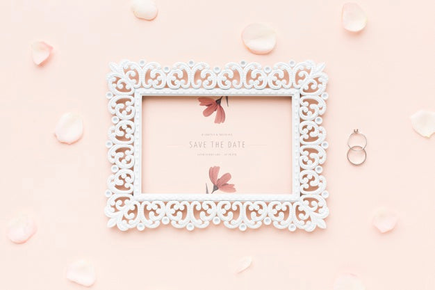 Frame Mock-Up And Wedding Rings With Flowers Psd