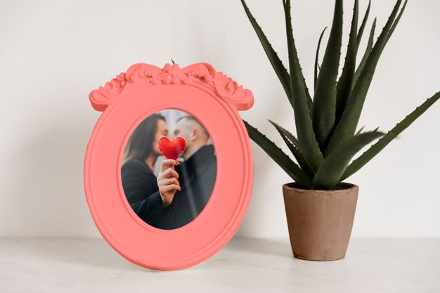 Frame Mockup Next To A Plant Psd