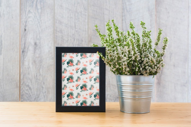 Frame Mockup Next To Plants Psd