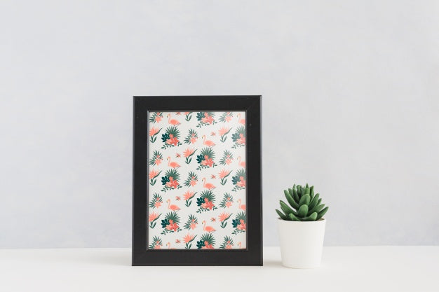 Frame Mockup Next To Plants Psd
