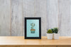 Frame Mockup On Table With Plants Psd