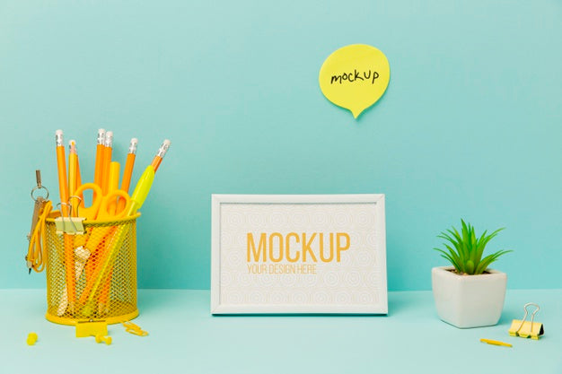 Frame Surrounded By Desk Plant And Pencils Psd
