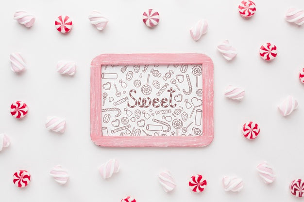 Frame With Delicious Candies Beside Psd