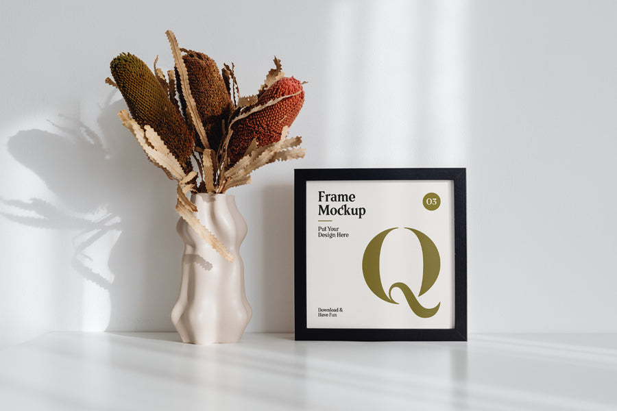 Frame With Flower On Desk Mockup