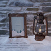 Frame With Winter View Beside Lantern Psd