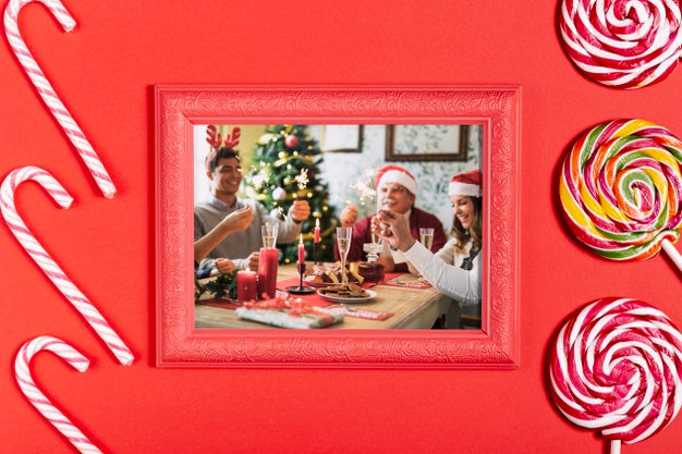 Framed Family Photo With Sugar Canes And Lollipops Psd