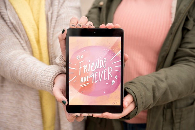 Friend Holding Happy Friendship Day Tablet Psd