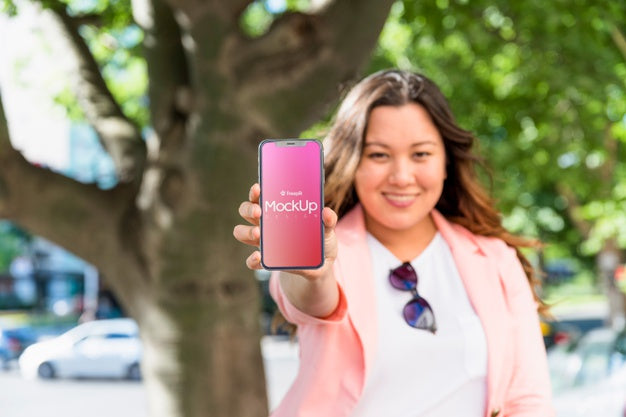 Friendly Woman Presenting Smartphone Mockup Psd