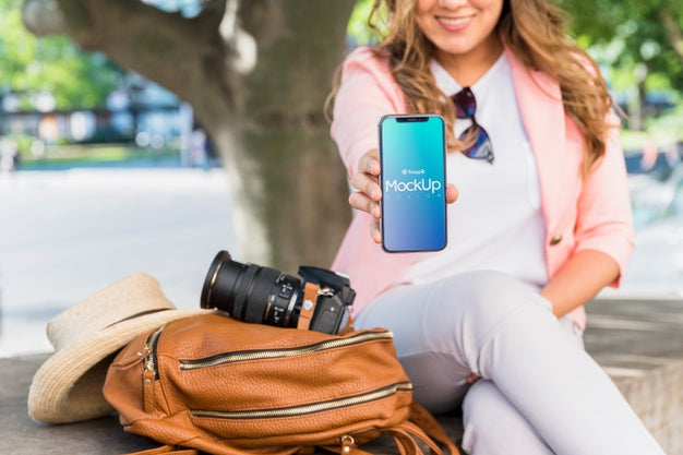 Friendly Woman Presenting Smartphone Mockup Psd