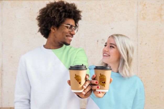 Friends Wearing Hoodies And Drinking Coffee Psd