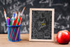 Front View Back To School Concept With Chalkboard Psd