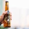 Front View Beer Bottle Held By Person Psd