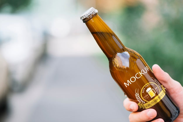 Front View Beer Bottle Held By Person Psd
