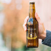 Front View Beer Bottle Held By Person Psd