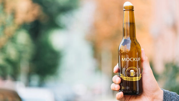 Front View Beer Bottle Held By Person Psd