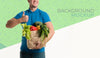 Front View Delivery Man Holding A Box With Different Vegetables Mock-Up Psd