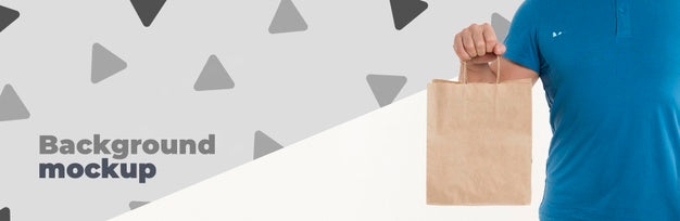 Front View Delivery Man Holding A Shopping Bag Psd