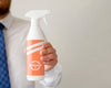 Front View Man Holding A Cleaning Bottle With Copy Space Psd