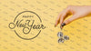 Front View New Year Lettering With Festive Disco Balls Psd