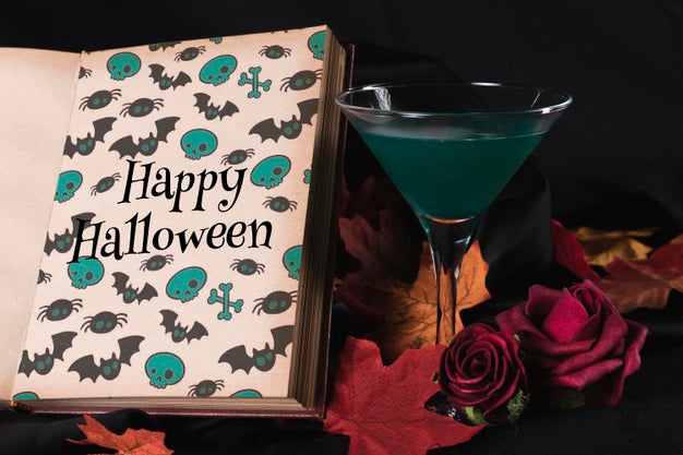 Front View Of A Book And Glass With Leaves Psd