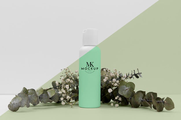 Front View Of Beauty Product Bottle With Plant Psd