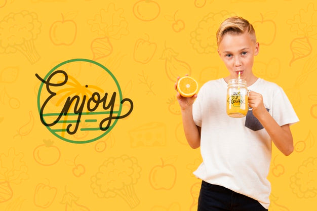 Front View Of Child Drinking Orange Juice Psd