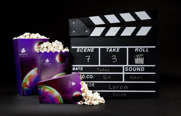 Front View Of Cinema Popcorn Cups With Clapperboard Psd