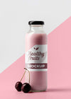 Front View Of Clear Juice Bottle With Cherries Psd