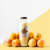 Front View Of Clear Juice Bottle With Peaches Psd