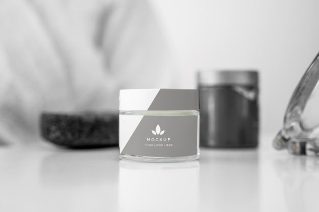 Front View Of Cosmetic Bottles On The Table With Defocused Woman Psd