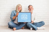 Front View Of Couple Holding A Frame Mock-Up Psd