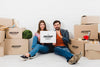 Front View Of Couple Posing With Moving Boxes Psd