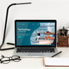Front View Of Desk Surface With Lamp And Glasses Psd