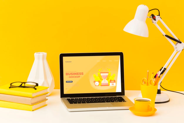 Front View Of Desk With Lamp And Laptop Psd