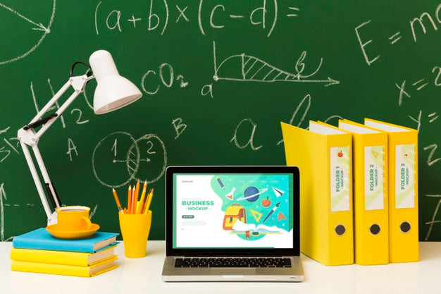 Front View Of Desk With Laptop And Lamp Psd