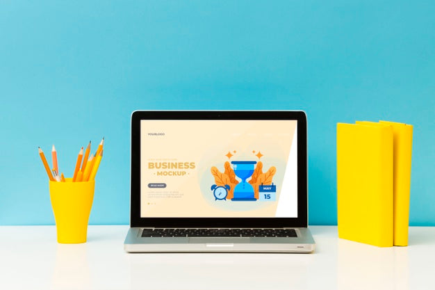 Front View Of Desk With Laptop And Pencils Psd
