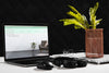 Front View Of Desk With Laptop And Plant Psd