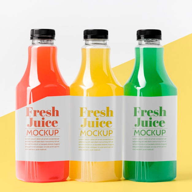 Front View Of Different Glass Juice Bottles With Caps Psd