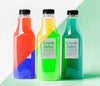 Front View Of Different Transparent Juice Bottles With Caps Psd