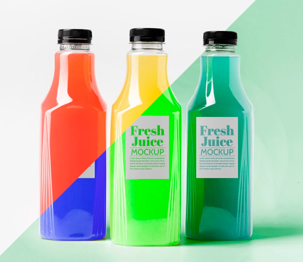 Front View Of Different Transparent Juice Bottles With Caps Psd
